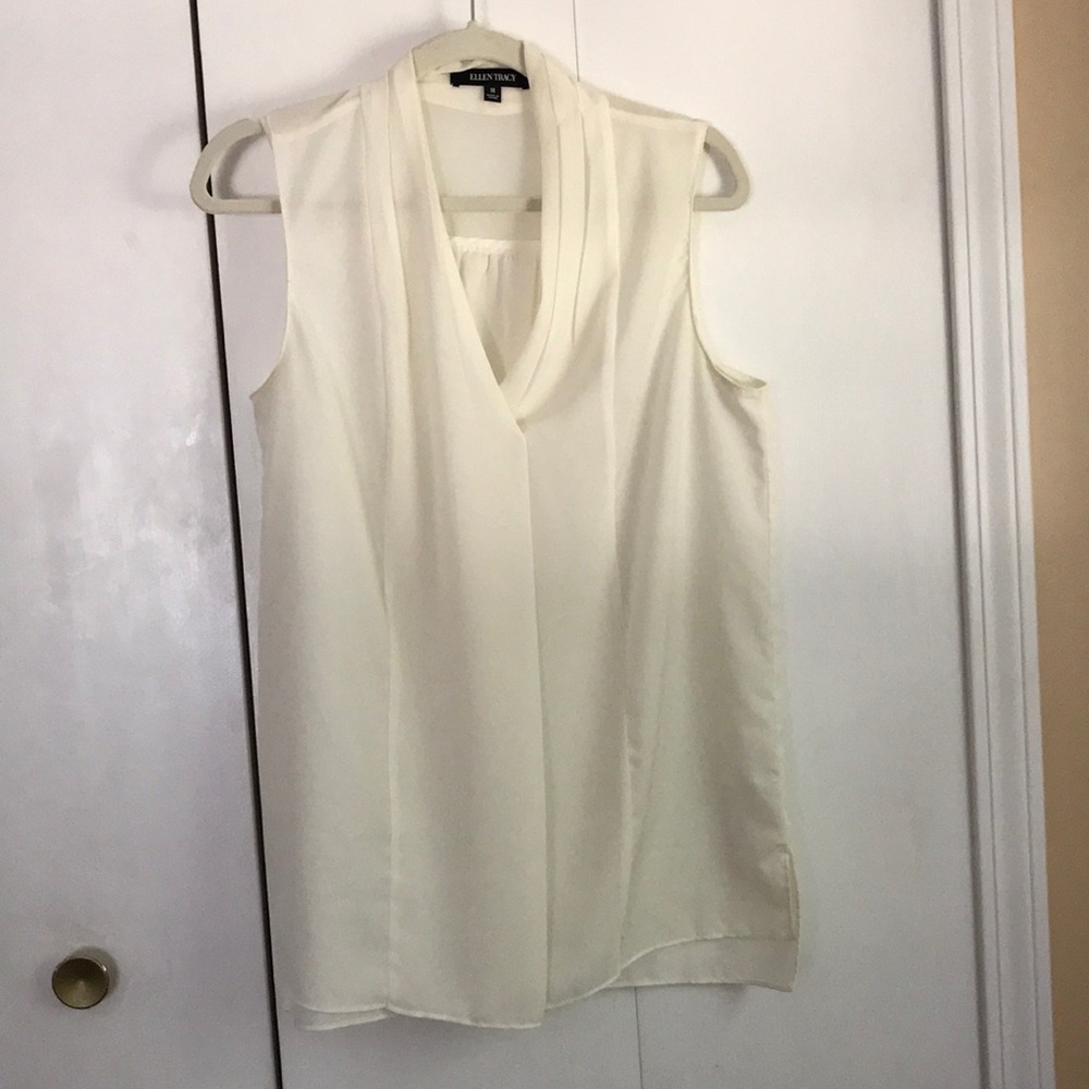 Cream sleeveless top in like new condition